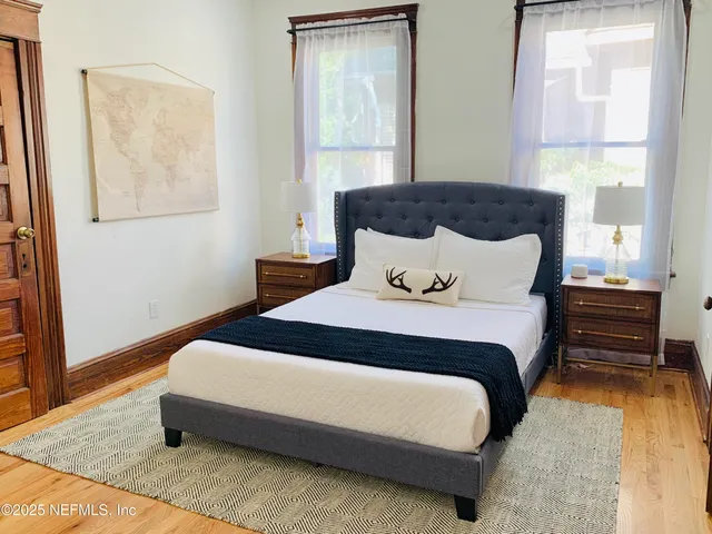 a bedroom with bed and window