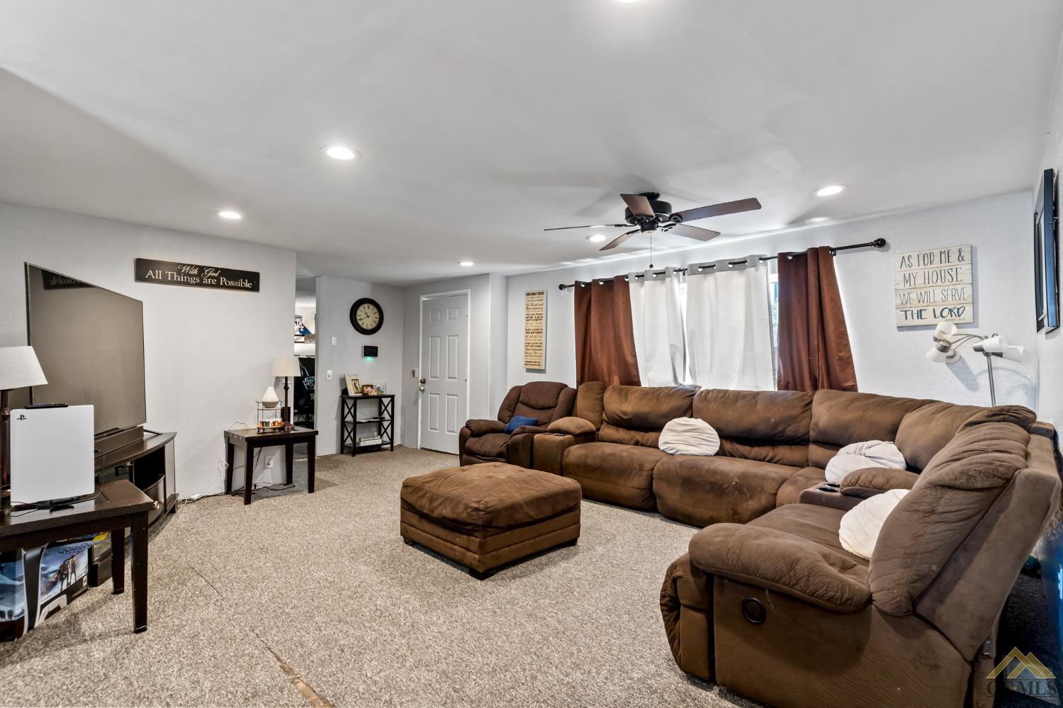 Undisclosed Address Bakersfield, CA 93306 - Photo 13 of 28 a living room with furniture and a window
