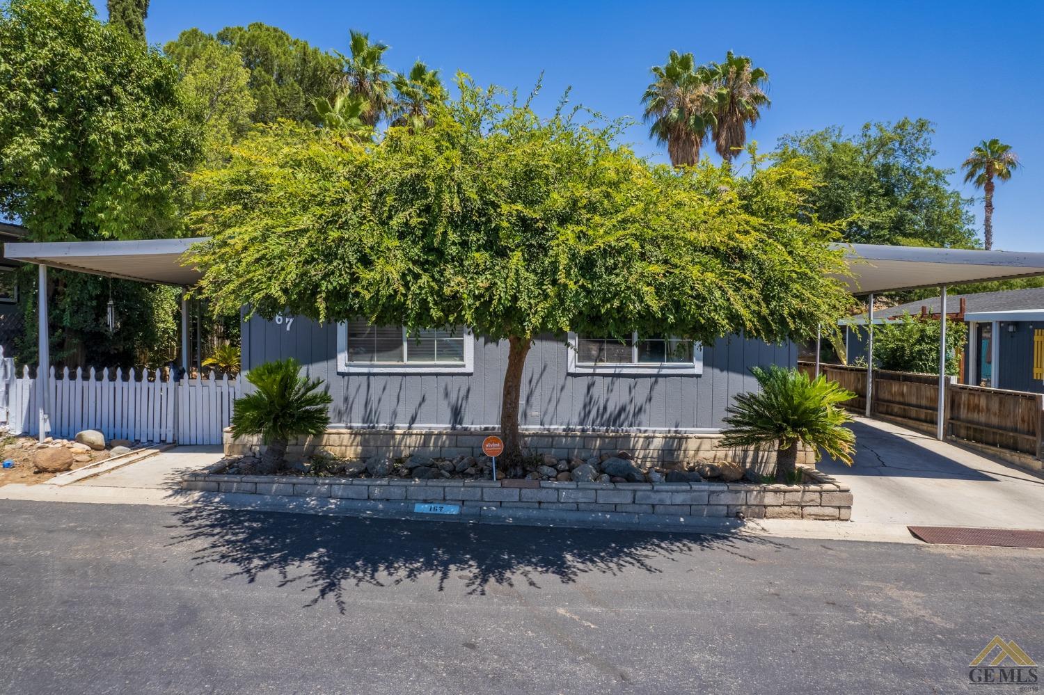 Undisclosed Address Bakersfield, CA 93306 - Photo 2 of 28 a view of a backyard with plants and a garden