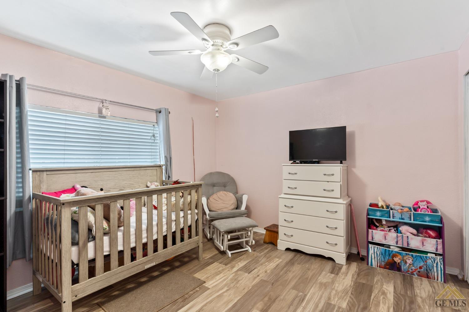 Undisclosed Address Bakersfield, CA 93306 - Photo 23 of 28 a bedroom with furniture and a flat screen tv