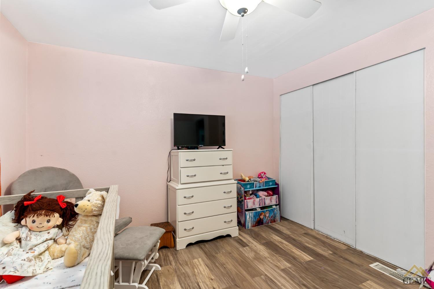 Undisclosed Address Bakersfield, CA 93306 - Photo 24 of 28 a room with furniture and a flat screen tv