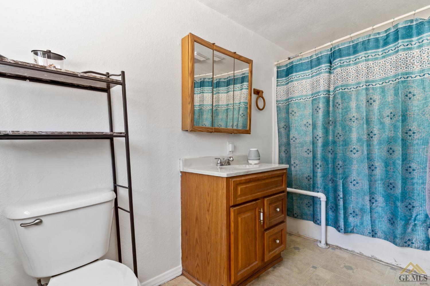 Undisclosed Address Bakersfield, CA 93306 - Photo 28 of 28 a bathroom with a sink a toilet and shower