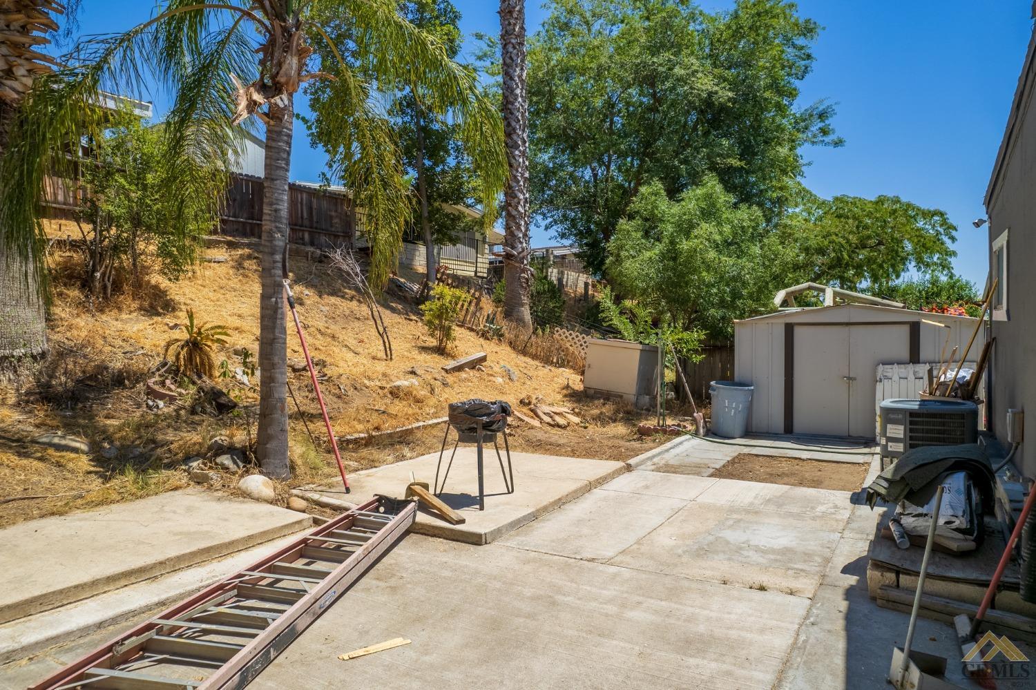 Undisclosed Address Bakersfield, CA 93306 - Photo 10 of 28 a view of a backyard with chairs