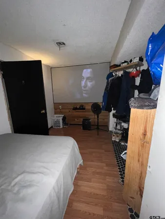 a bed room with a bed and a walk in closet