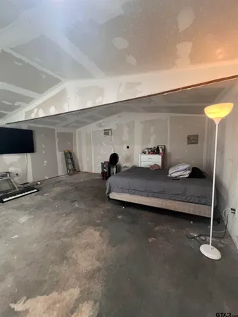 a room with gym equipment and a window