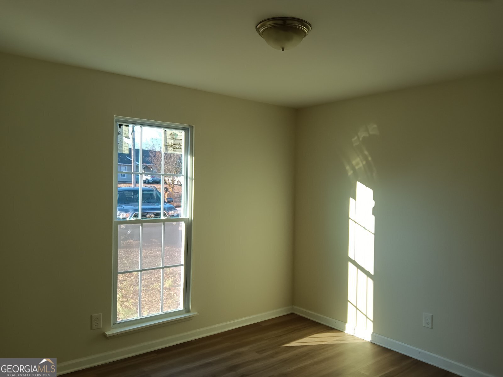 3668 Paddington Trail Rex, GA 30273 - Photo 13 of 21 an empty room with wooden floor and windows