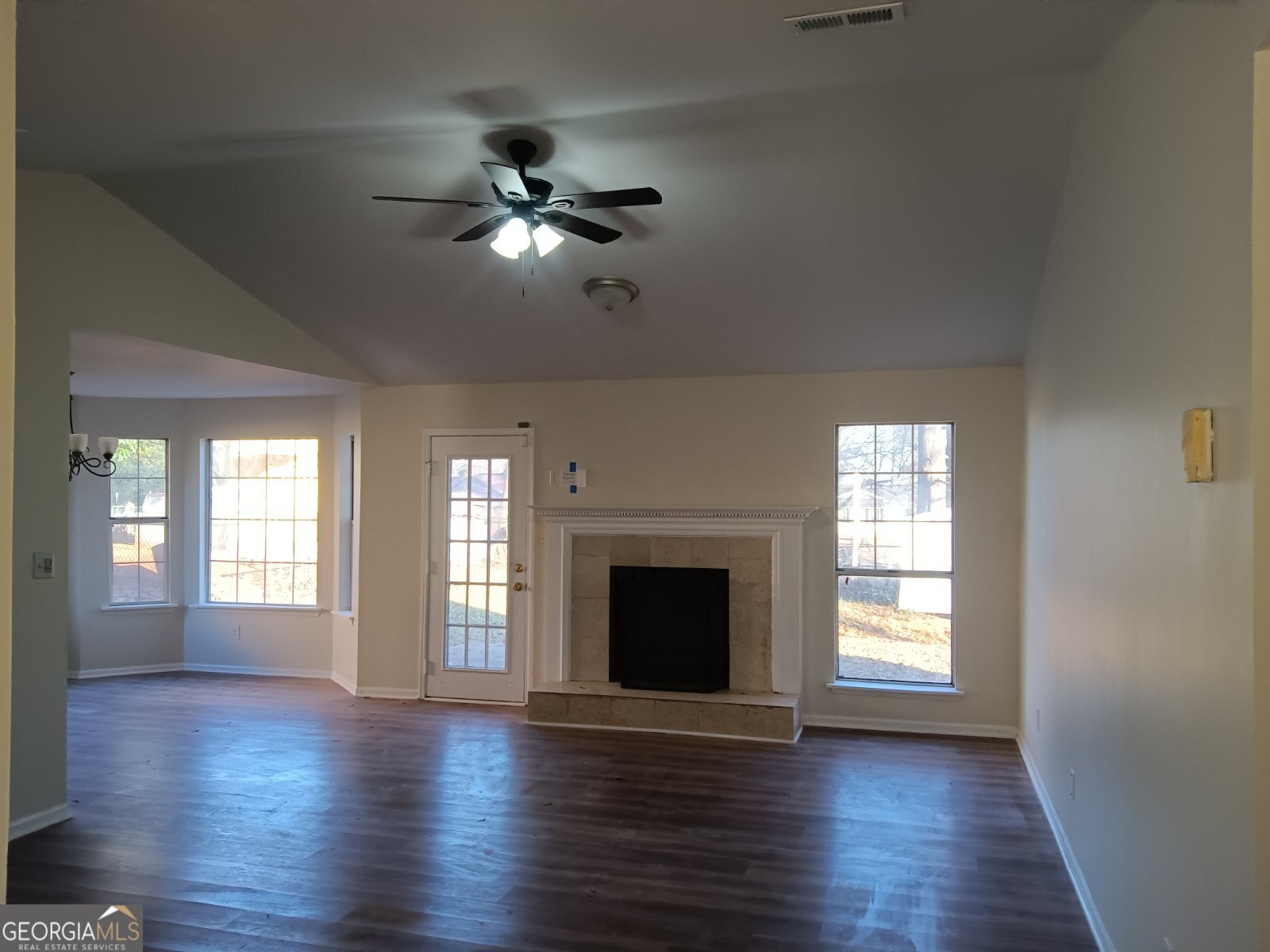 3668 Paddington Trail Rex, GA 30273 - Photo 17 of 21 a view of an empty room with wooden floor and a window