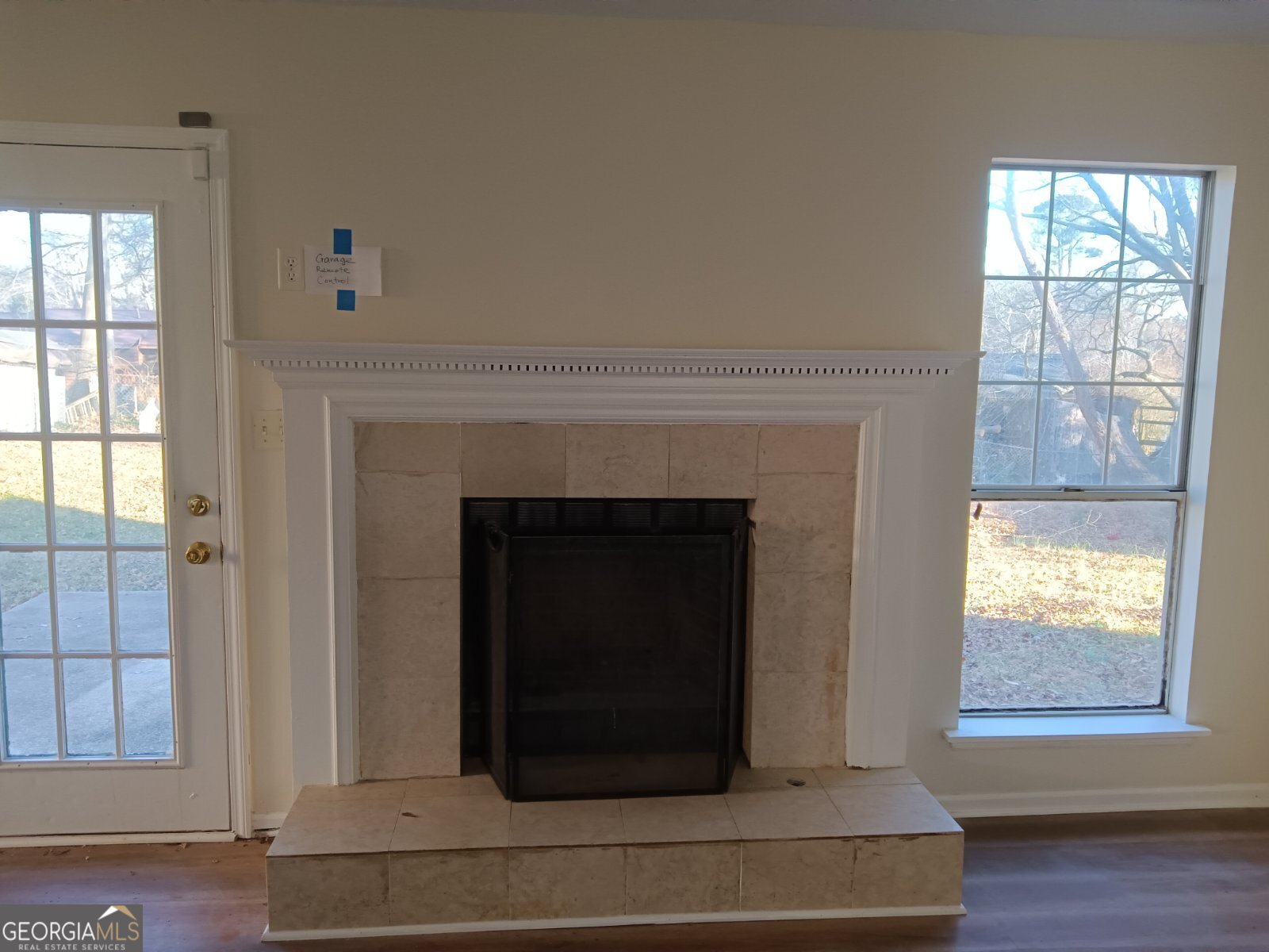 3668 Paddington Trail Rex, GA 30273 - Photo 4 of 21 a living room with a fireplace and windows