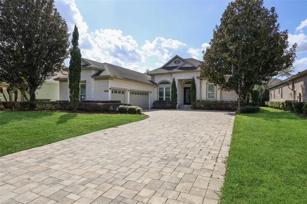 a front view of house with yard and green space