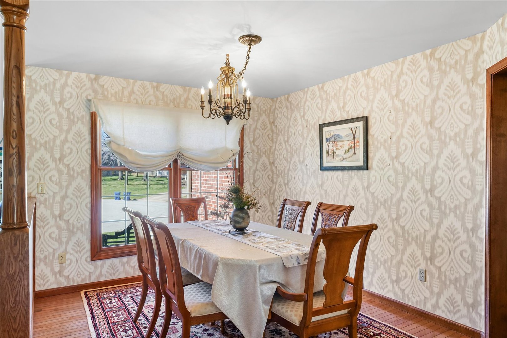 12 Turtle Creek Road Monticello, IL 61856 - Photo 16 of 63 a view of a dining room with furniture a chandelier and wooden floor