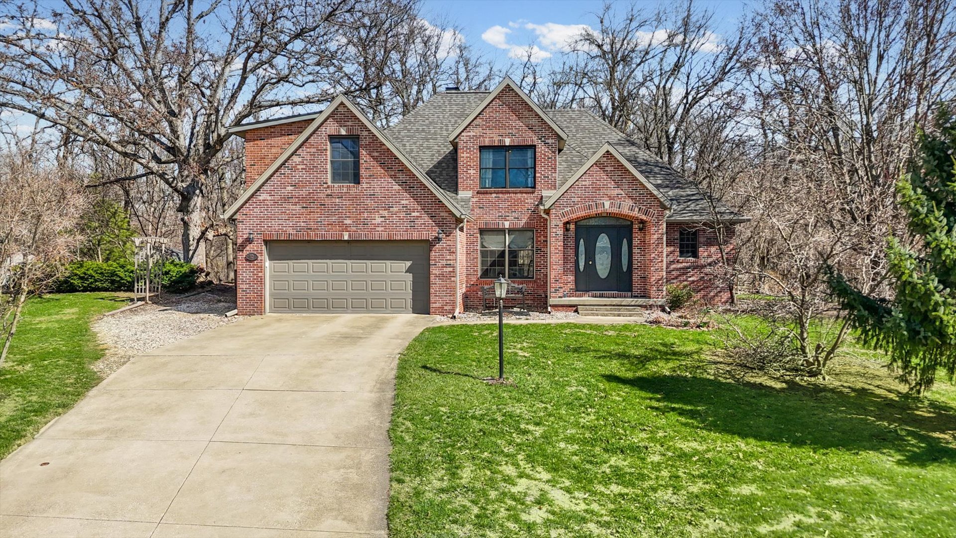12 Turtle Creek Road Monticello, IL 61856 - Photo 2 of 63 a front view of a house with a yard and garage