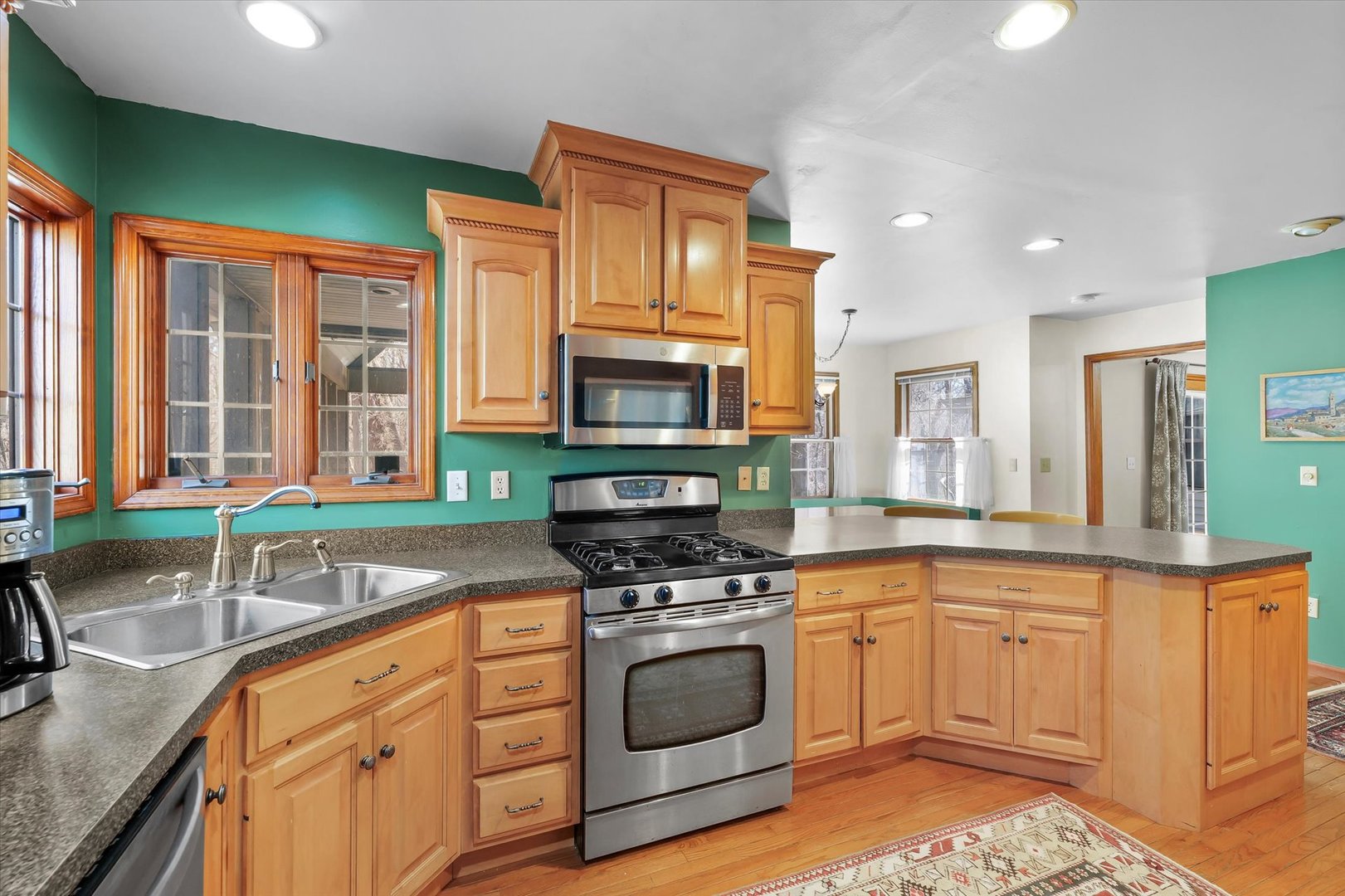 12 Turtle Creek Road Monticello, IL 61856 - Photo 21 of 63 a kitchen with granite countertop a sink stainless steel appliances and cabinets