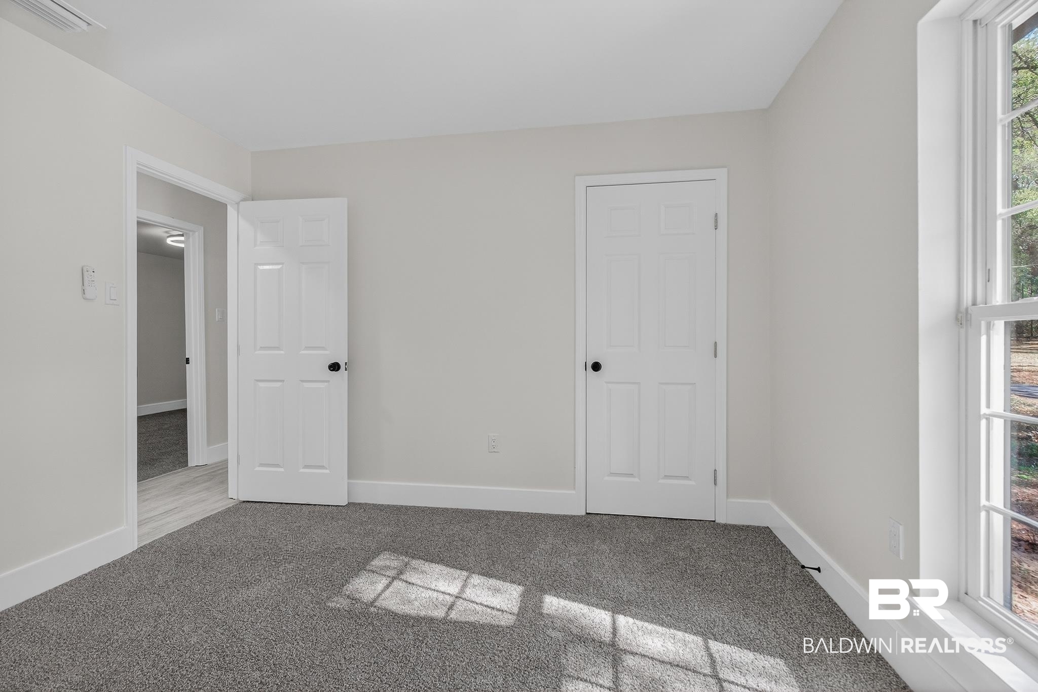 10650 Old Pascagoula Road Theodore, AL 36582 - Photo 43 of 77 Unfurnished bedroom with carpet flooring