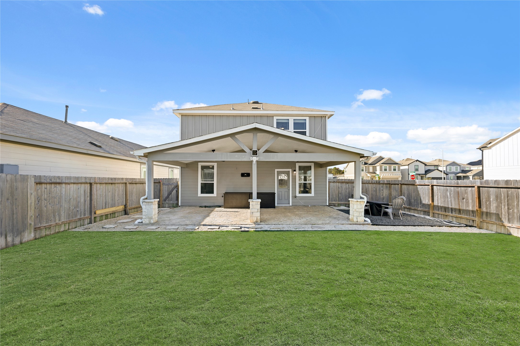 a house view with a sitting space and garden