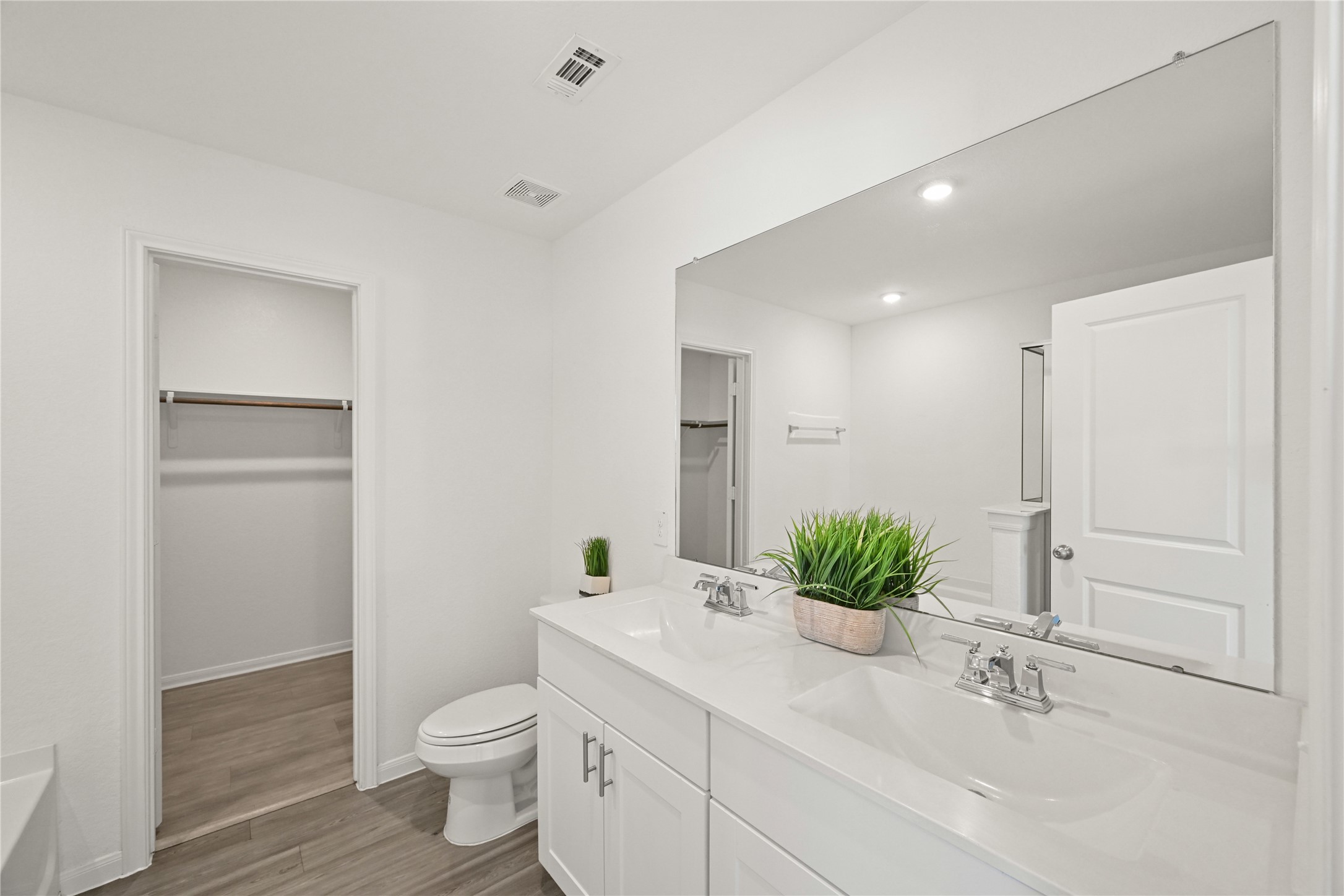 23442 Wrexham Street Spring, TX 77373 - Photo 12 of 33 a bathroom with a granite countertop sink a toilet and a mirror