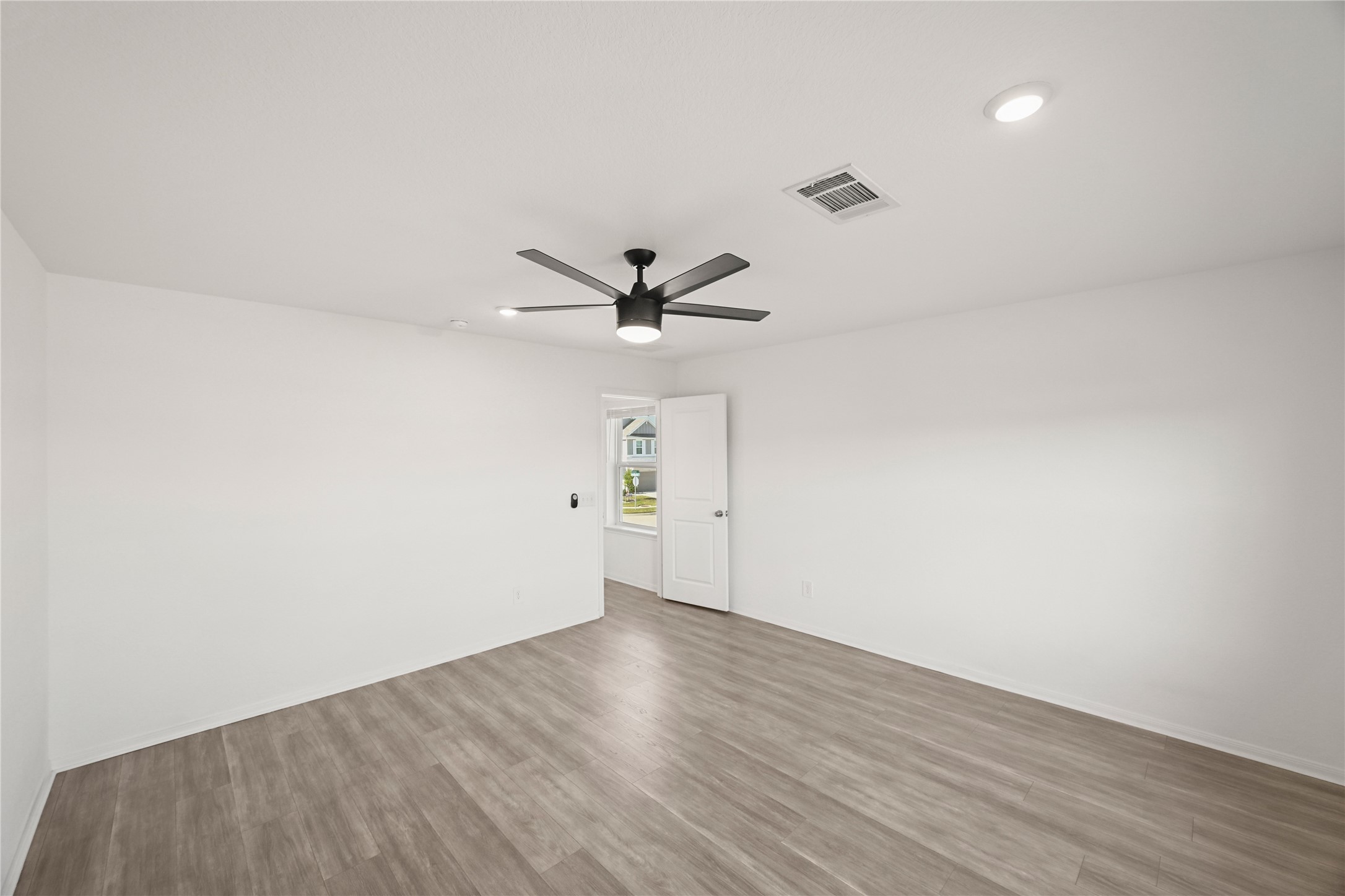 23442 Wrexham Street Spring, TX 77373 - Photo 17 of 33 a view of a big room with wooden floor and windows in a room