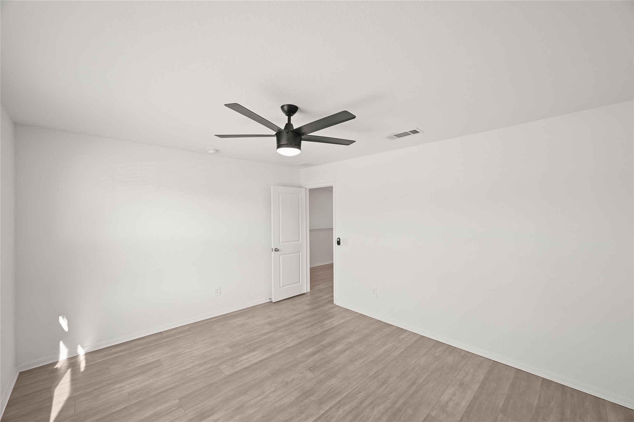 23442 Wrexham Street Spring, TX 77373 - Photo 26 of 33 a view of a big room with wooden floor closet and windows