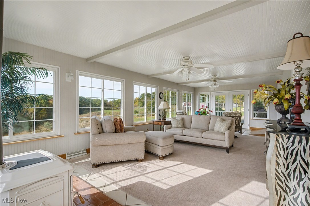 913 Rost Road Walker, WV 26180 - Photo 3 of 48 Sunroom with beamed ceiling and carpet floors