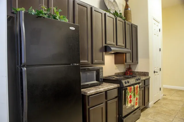 a close view of a sink and a refrigerator