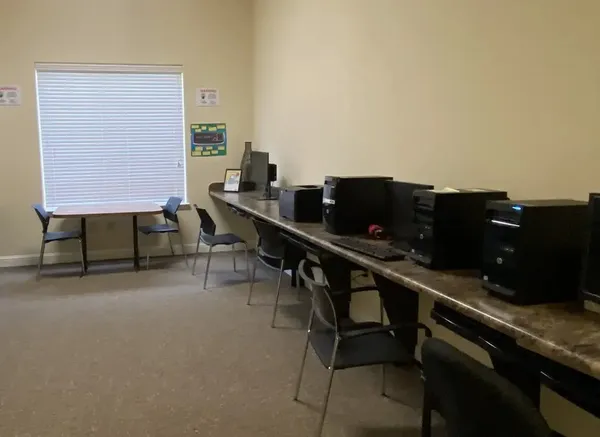 a view of a workspace with furniture