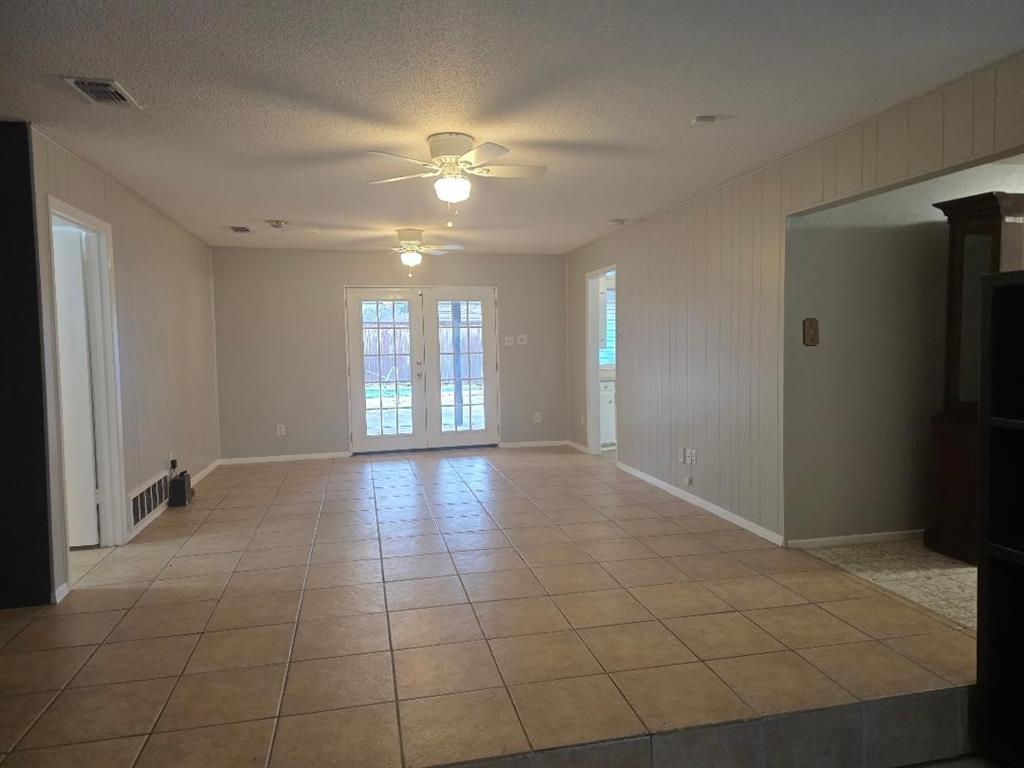 Undisclosed Address Hurst, TX 76054 - Photo 3 of 29 TILED FLOOR WITH FRENCH DOORS TO PATIO AND HEATED POOL