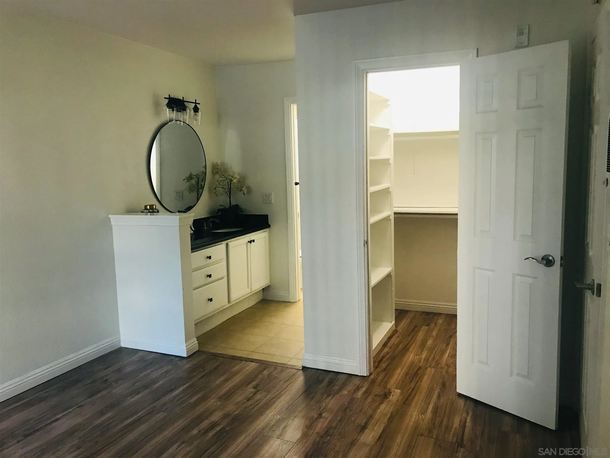 4860 Rolando Court, Unit 20 San Diego, CA 92115 - Photo 11 of 23 a view of a hallway with wooden floor
