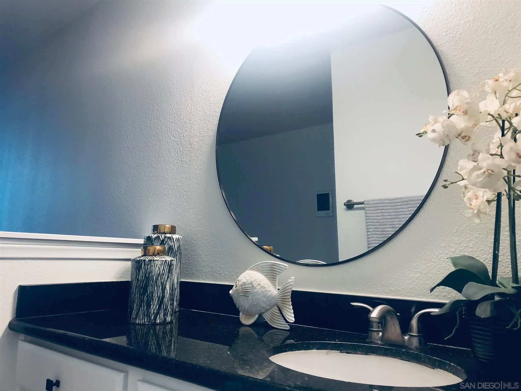 4860 Rolando Court, Unit 20 San Diego, CA 92115 - Photo 14 of 23 a bathroom with a sink mirror and vanity