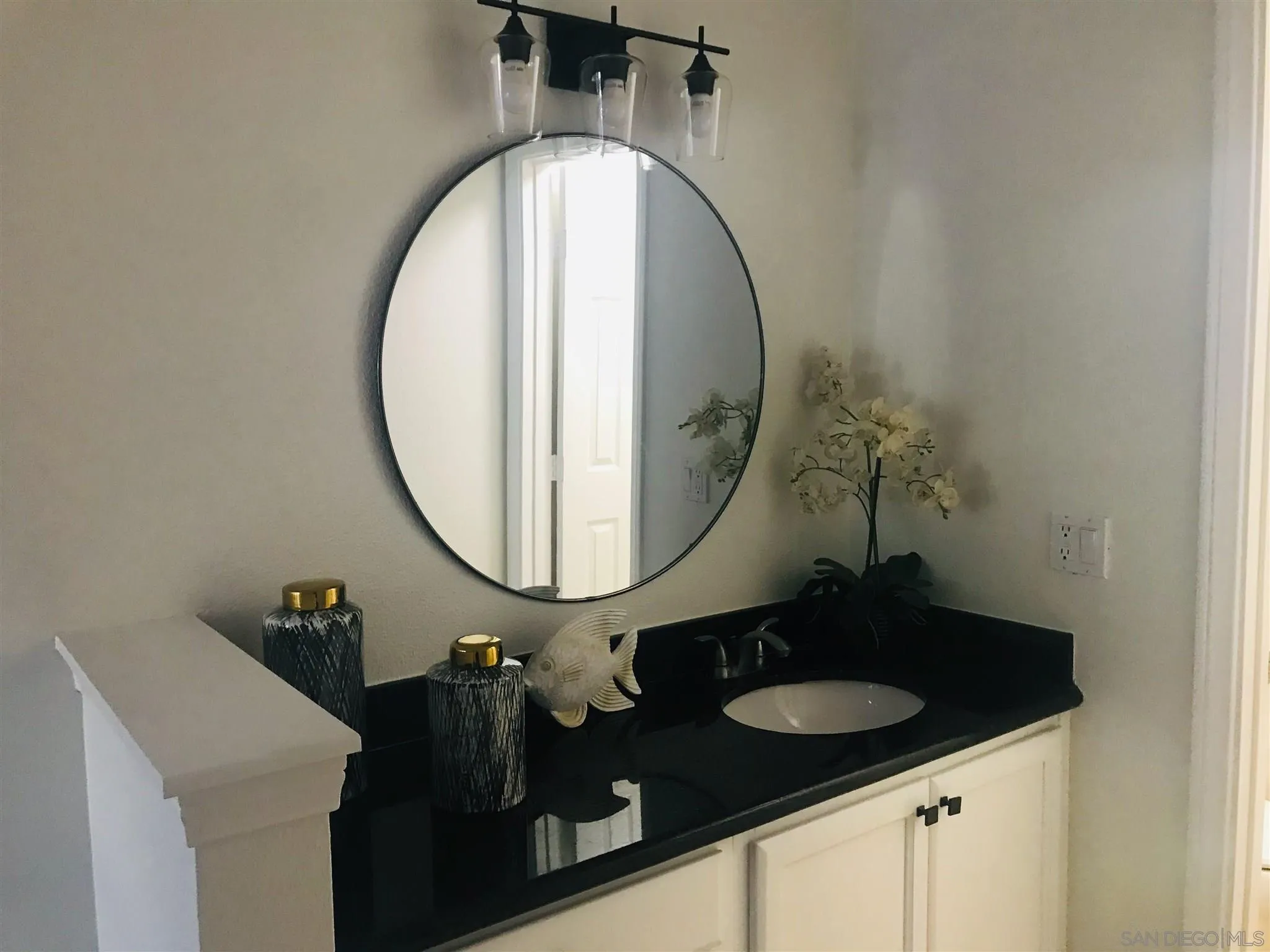 4860 Rolando Court, Unit 20 San Diego, CA 92115 - Photo 15 of 23 a bathroom with a sink and a mirror