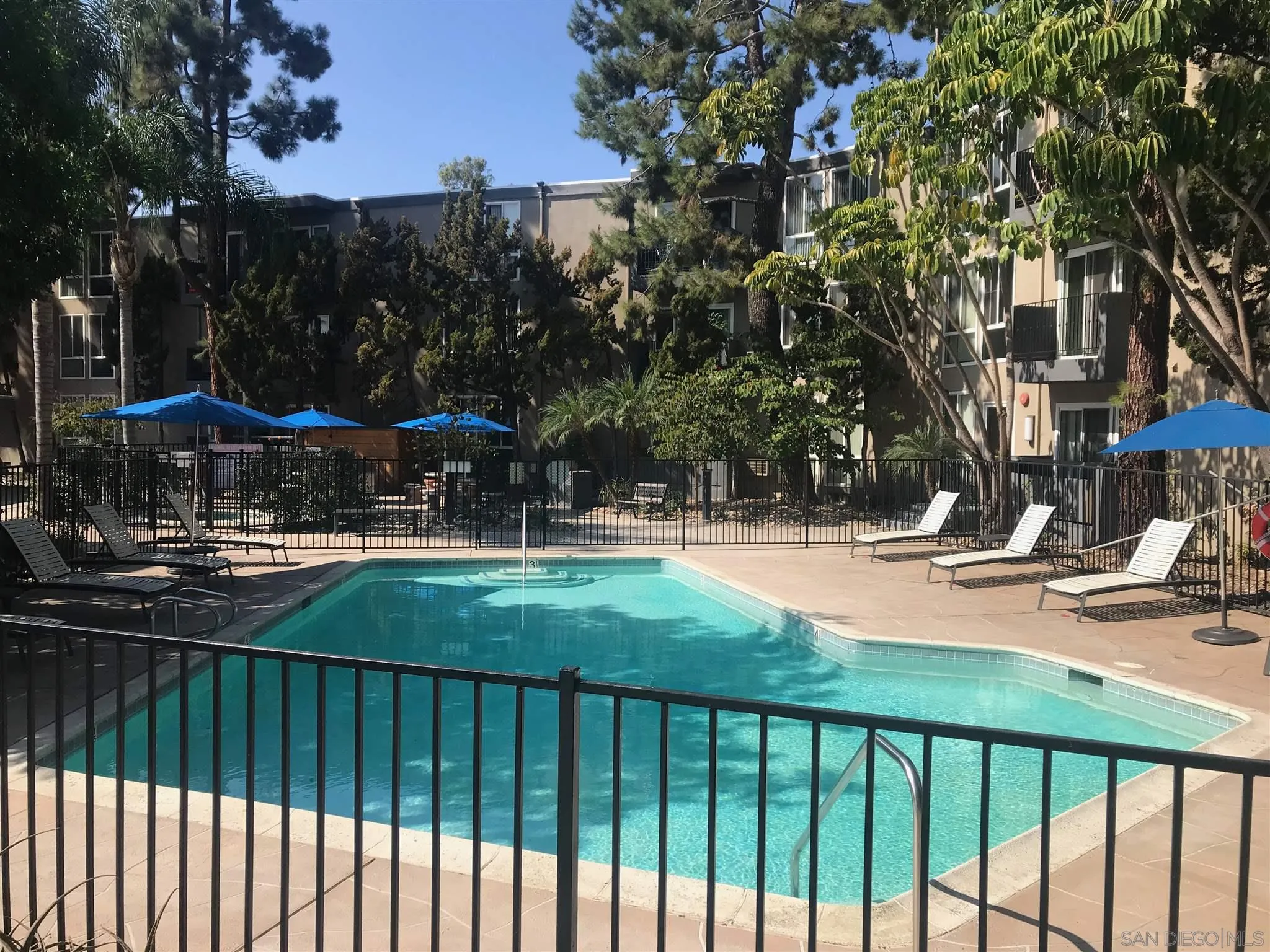 4860 Rolando Court, Unit 20 San Diego, CA 92115 - Photo 20 of 23 a view of swimming pool with outdoor seating and plants