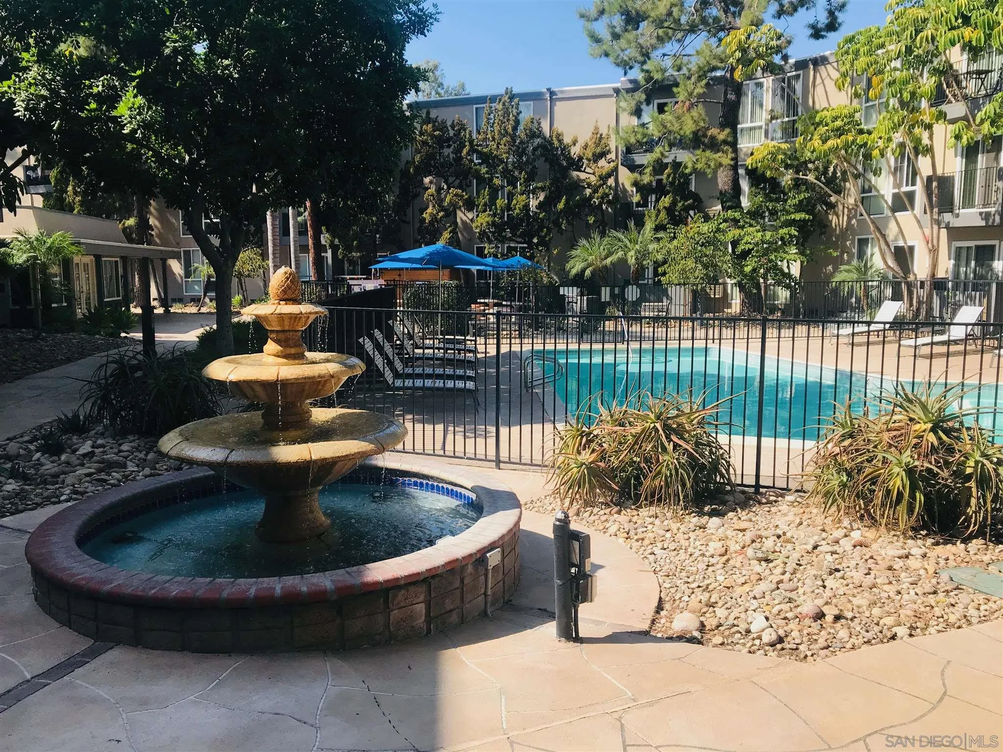 4860 Rolando Court, Unit 20 San Diego, CA 92115 - Photo 2 of 23 a view of a fountain is sitting in back yard of the house