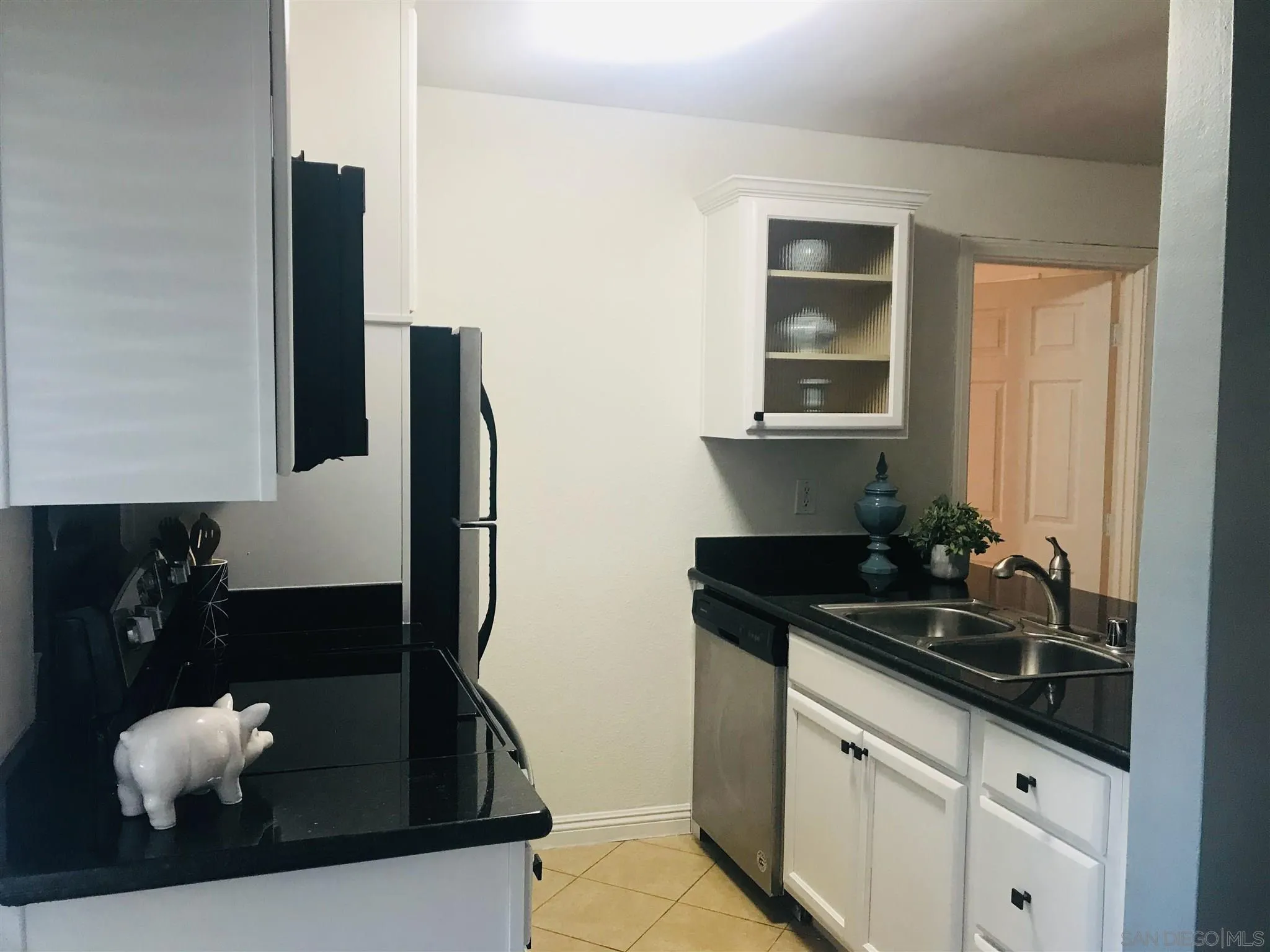 4860 Rolando Court, Unit 20 San Diego, CA 92115 - Photo 6 of 23 a kitchen with sink and refrigerator