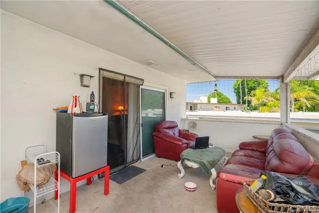 a living room with furniture and window