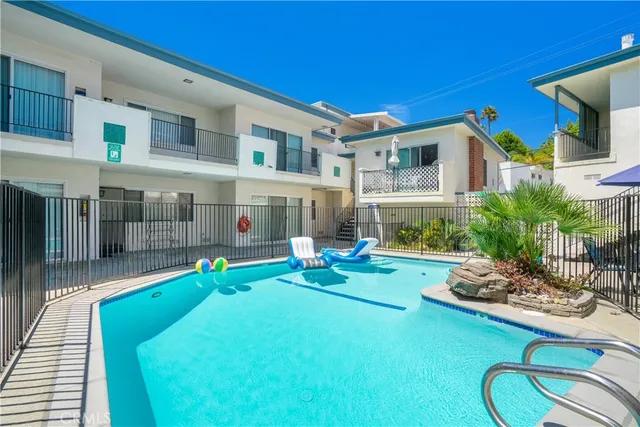 a view of an house with backyard porch and furniture