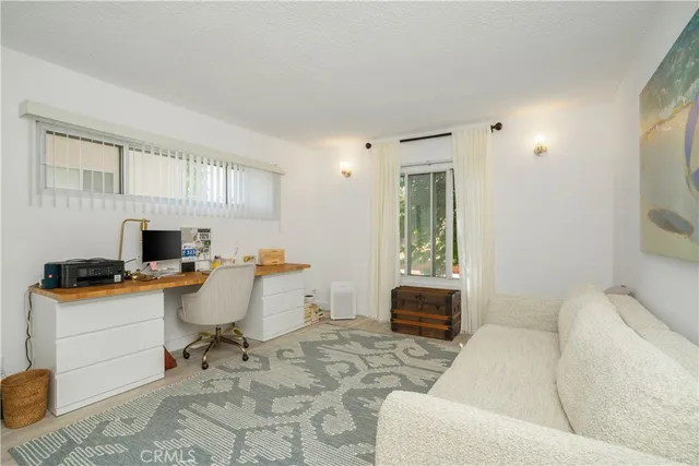 a workspace with furniture and window