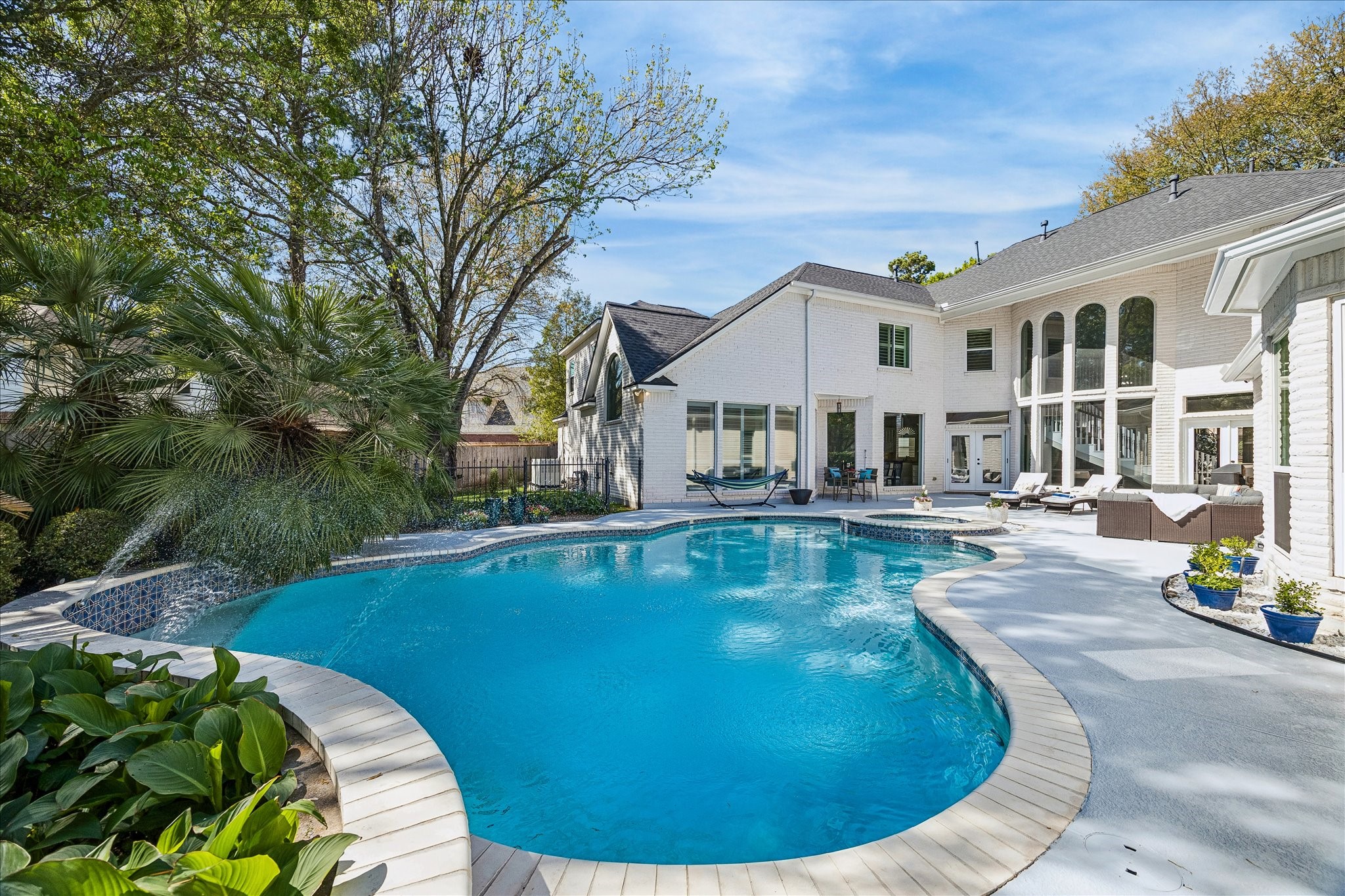 16407 Emilia Court Spring, TX 77379 - Photo 5 of 35 From the backyard looking toward the home this resort style pool area awaits lots of summer fun!
