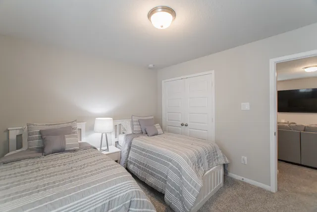 a bedroom with a bed and a view of bathroom