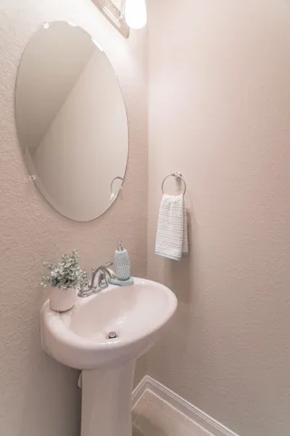 a bathroom with a sink and mirror