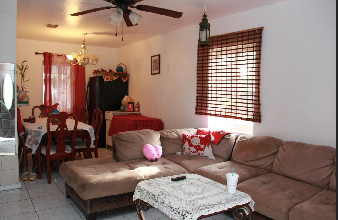 1402 South C Street Lake Worth Beach, FL 33460 - Photo 18 of 27 a living room with furniture and a window