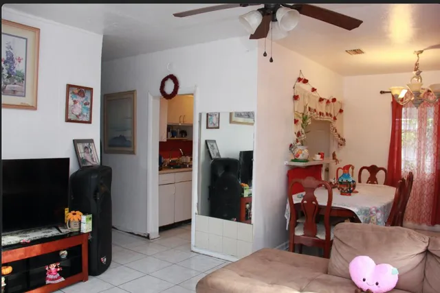 a living room with furniture and a flat screen tv