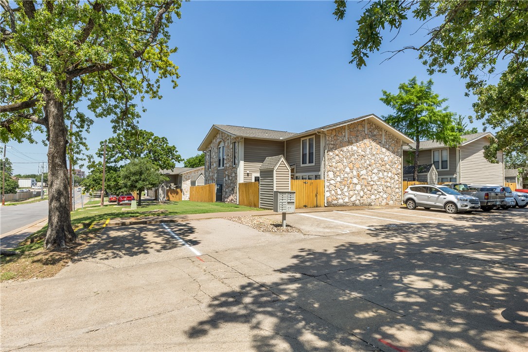 2101 Barak Lane, Unit 17 Bryan, TX 77802 - Photo 2 of 19 a view of a house with a yard and tree