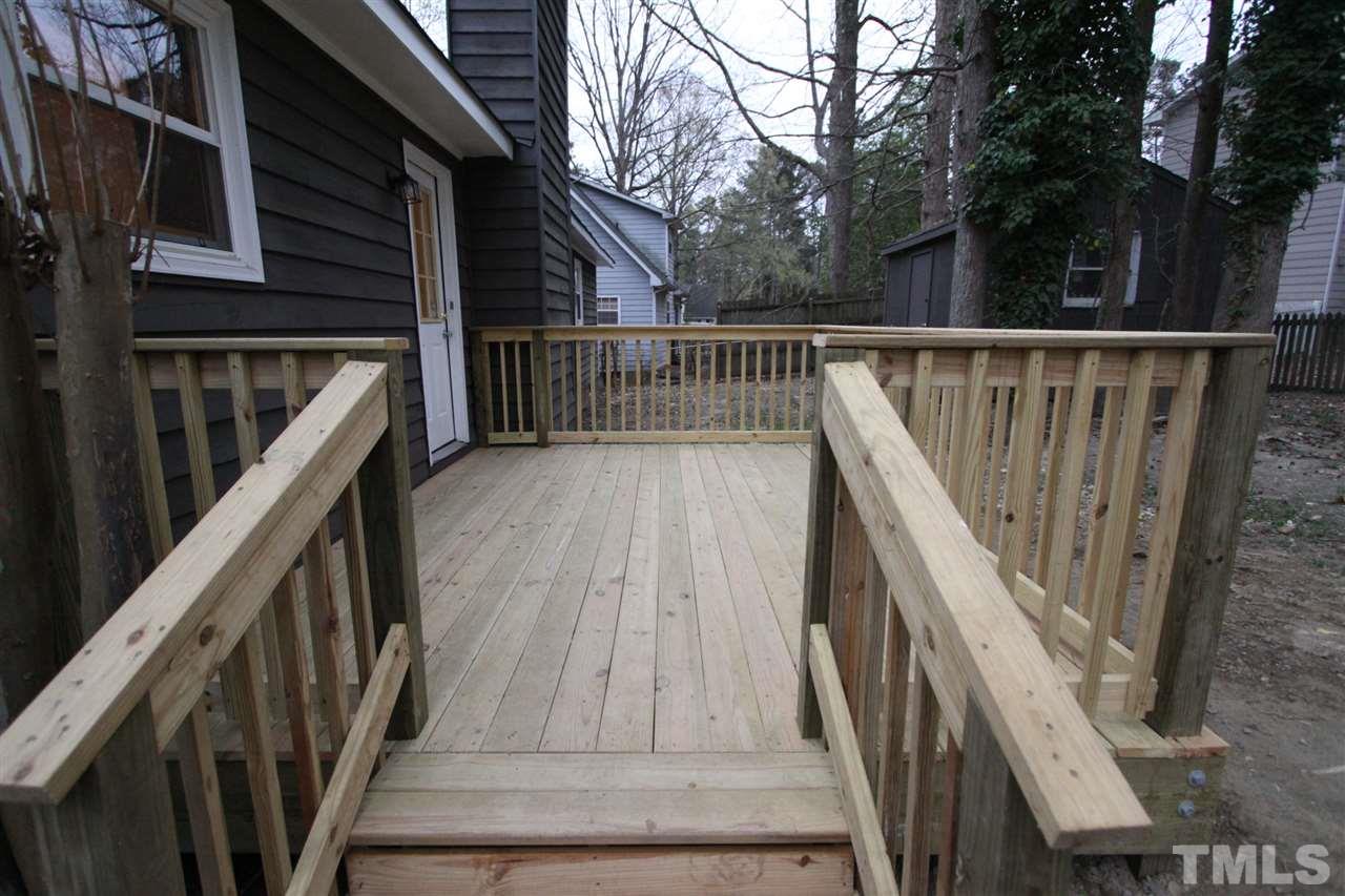 845 Horton Road Durham, NC 27704 - Photo 11 of 14 a view of balcony with wooden floor and fence