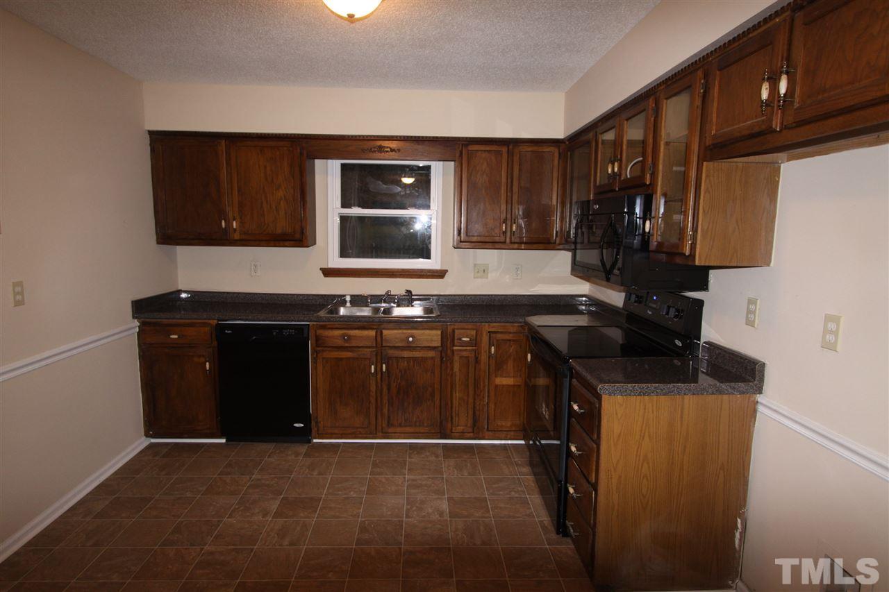 845 Horton Road Durham, NC 27704 - Photo 4 of 14 a kitchen with a sink and a stove top oven