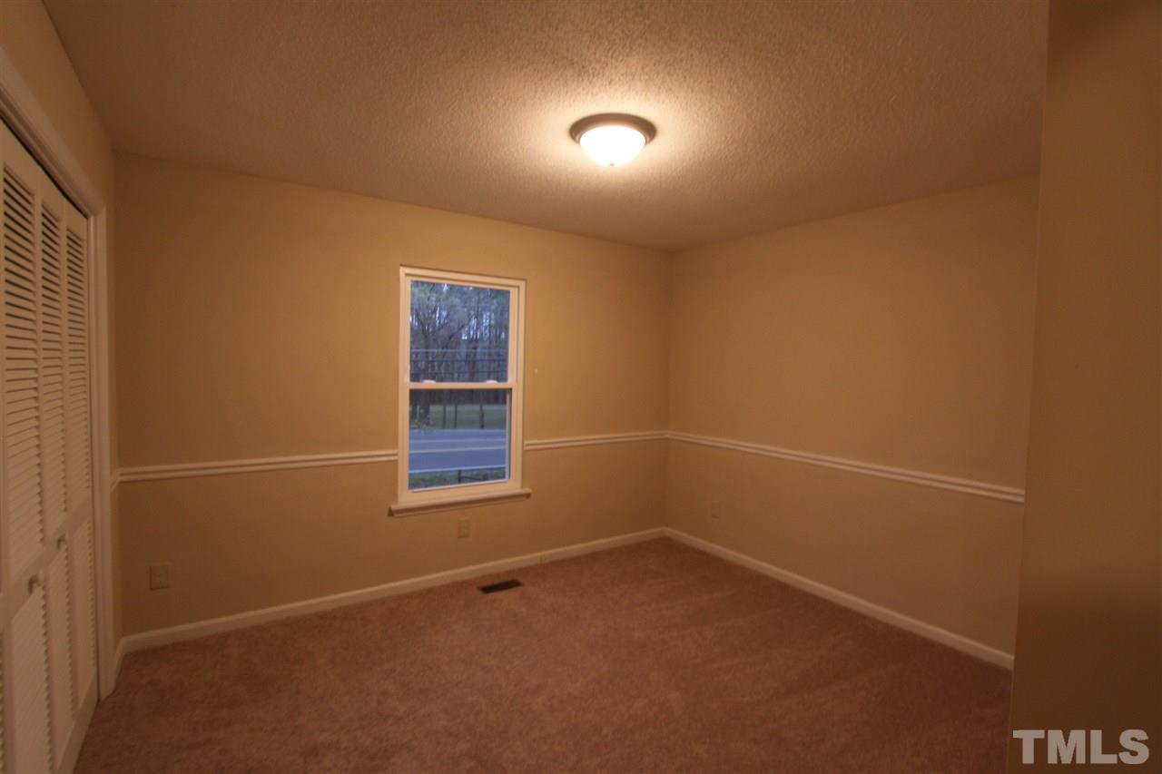 845 Horton Road Durham, NC 27704 - Photo 9 of 14 an empty room with a window