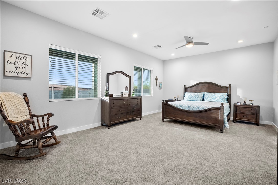 432 North Racetrack Road Henderson, NV 89015 - Photo 32 of 45 Bedroom with light colored carpet, a ceiling fan, and recessed lighting