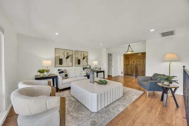 a kitchen with a stove a sink and a microwave