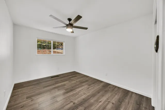 a view of backyard with deck and outdoor seating