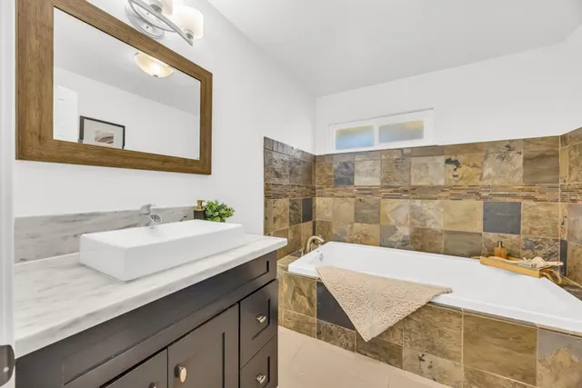 a view of a balcony with wooden floor and iron stairs