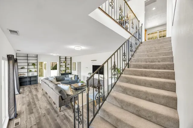 an aerial view of a house with a yard basket ball court and outdoor seating