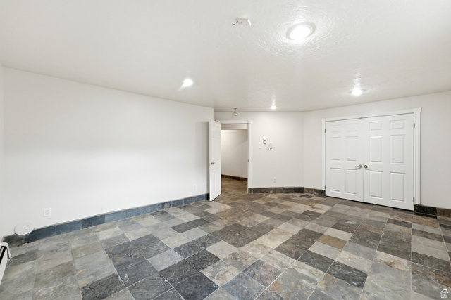 3535 Homestead Road Park City, UT 84098 - Photo 56 of 81 Spacious room featuring multi-toned slate tile flooring, white walls, and a recessed lighting system