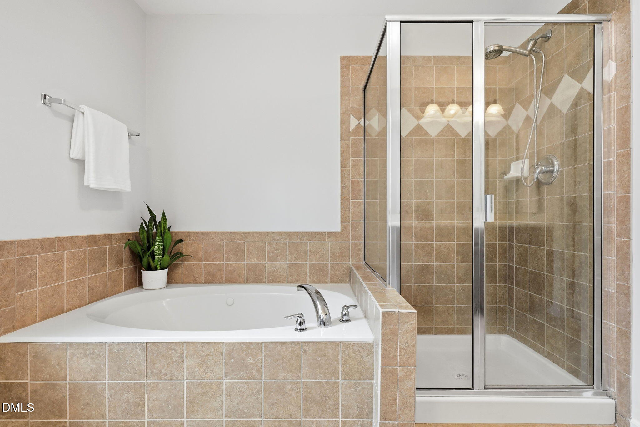 162 Gathering Place Durham, NC 27713 - Photo 25 of 52 a bathroom with a bathtub and a shower